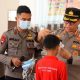 Di Tengah Kabut Asap Karhutla, Brimob Polda Jambi Beri Motivasi serta Perhatian Kesehatan Pelajar Sekolah Rakyat